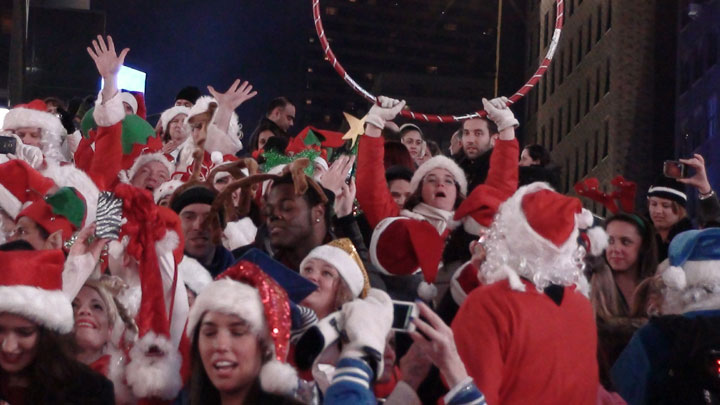 Santas take over the red steps at Times Square